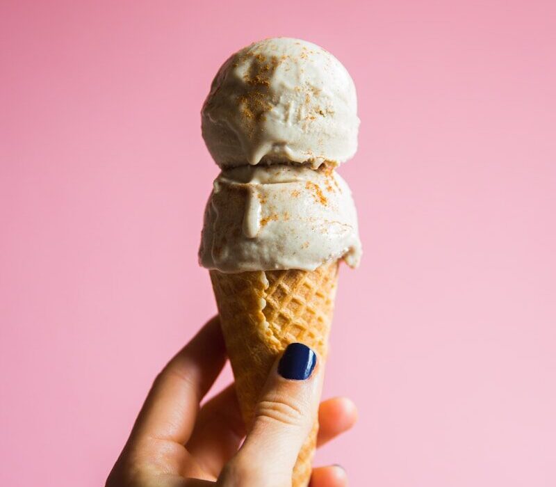 person holding ice cream on cone