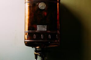 a brown suitcase sitting on top of a metal pole