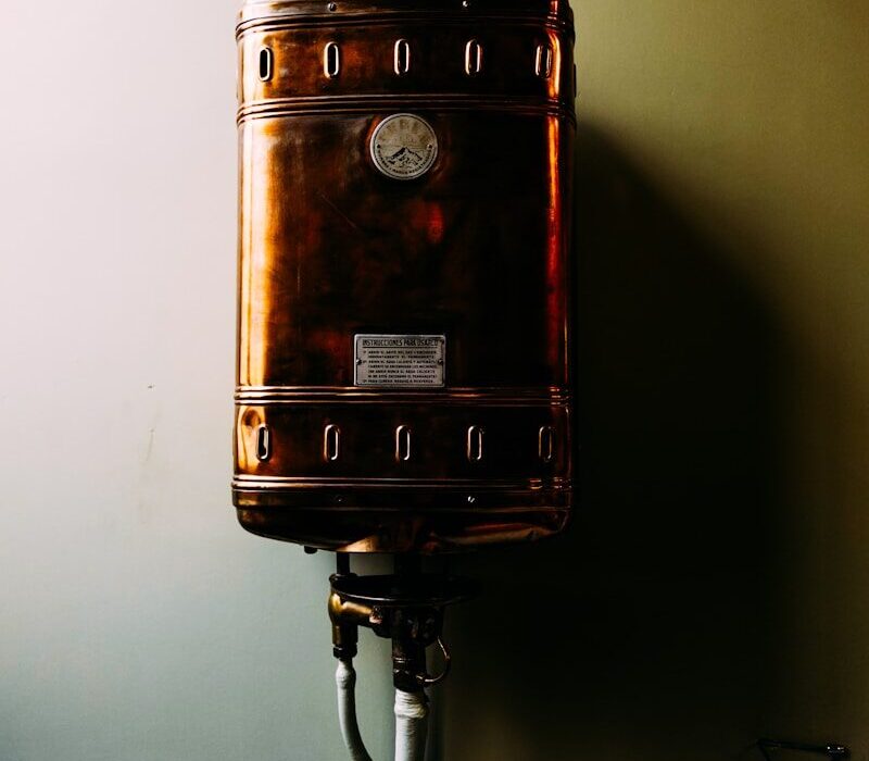 a brown suitcase sitting on top of a metal pole